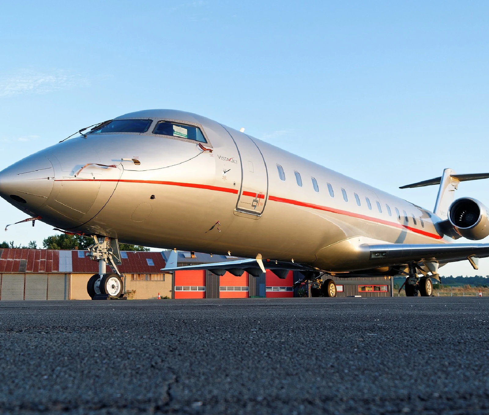 A large airplane sitting on top of an airport runway.